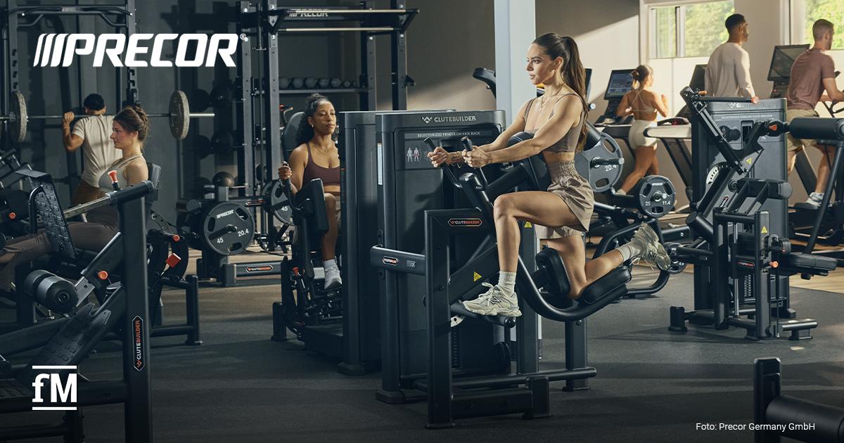 Precor® neue Glutebuilder® Selectorized Line Trainierende an Geräten der Precor Glutebuilder Selectorized Line in einem Fitnessstudio.