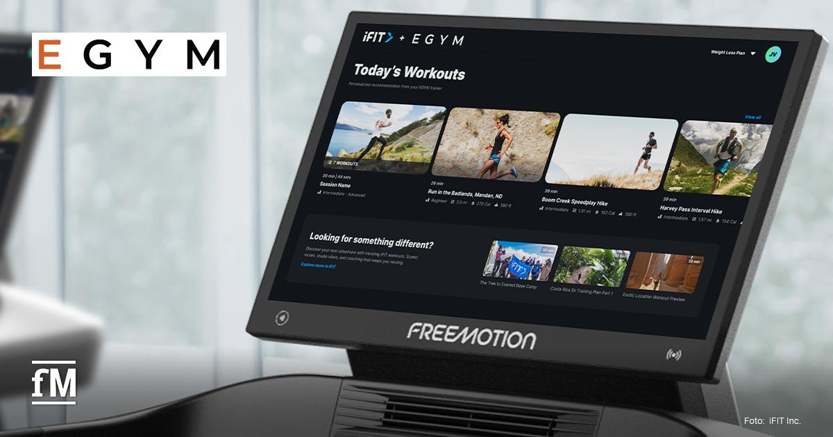 Bildschirm eines Freemotion-Cardiogeräts mit Anzeige „iFIT + EGYM Today’s Workouts“, mehreren Trainingskacheln und EGYM-Logo oben links im Bild.